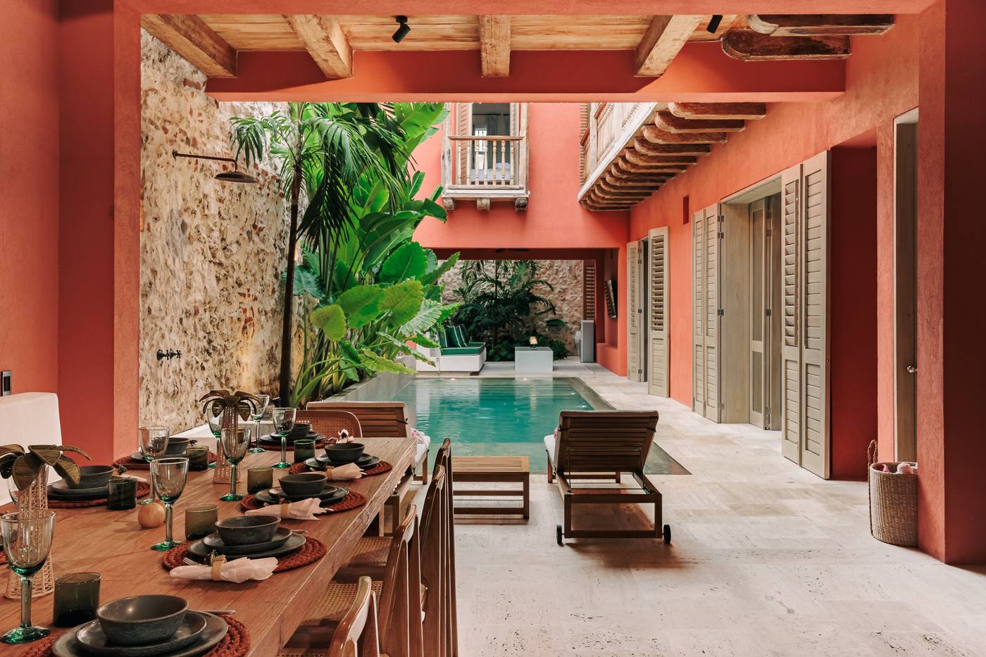 Courtyard dining table beside the pool at Casa Kai